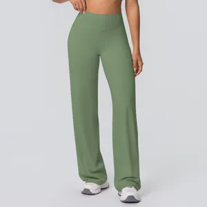 Detail of high-waist yoga pants featuring wide waistband and soft sage green fabric texture