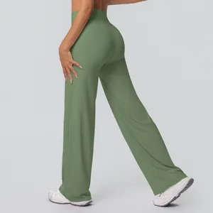 Detail view of high-waisted wide-leg yoga pants in Morandi green with smooth fabric texture