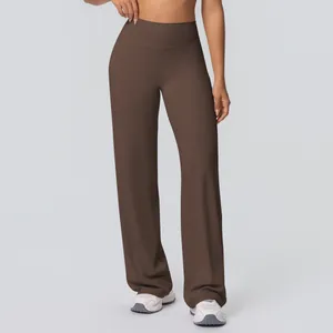 Detail of high waisted wide leg yoga pants in dark brown with breathable fabric