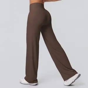 Detail shot of chocolate brown high-waisted wide-leg yoga pants showing the lift effect