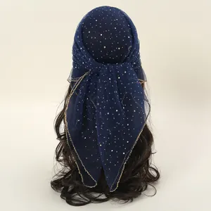 Detailed back view of navy blue rhinestone headscarf tied on a hair model