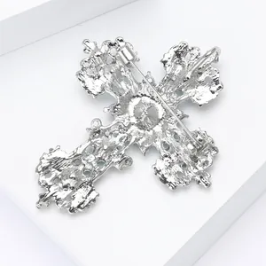 Vintage silver hollow cross brooch with intricate floral texture and long pin back