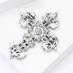 Vintage silver hollow cross brooch with baroque relief patterns and pin fastening
