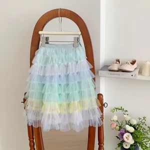 Detail of multi-layered macaron gradient mesh tutu skirt with soft pastel tiers