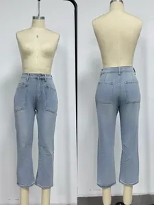 Detail view of the large utilitarian utility pockets on light blue high-waist jeans