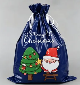 Detail of dark blue Merry Christmas drawstring gift bag with Santa and tree print