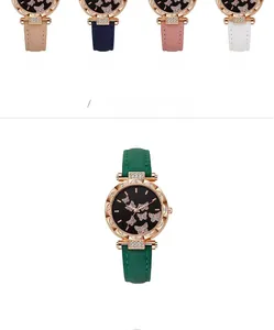 Dettaglio degli orologi con quadrante a farfalla e ghiere di strass in cinque colori