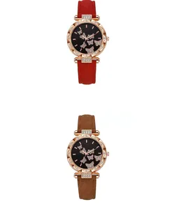 Dettaglio degli orologi da donna con motivi a farfalla e strass decorativi