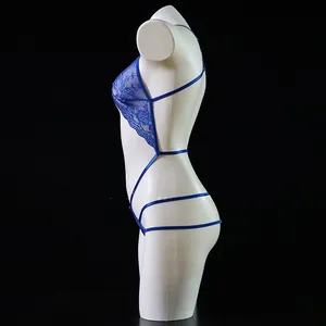 Close-up of blue floral lace pattern and hollow cut-outs on the teddy bodysuit
