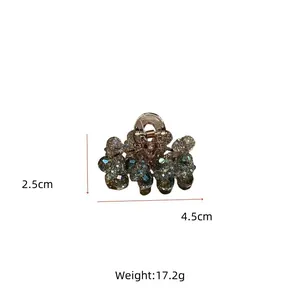 Detailed view showing dimensions 4.5cm by 2.5cm of crystal hair claw with gold alloy