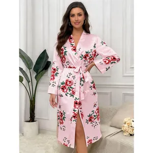 Detailed view of pink floral satin robe with luxury rose print and waist tie