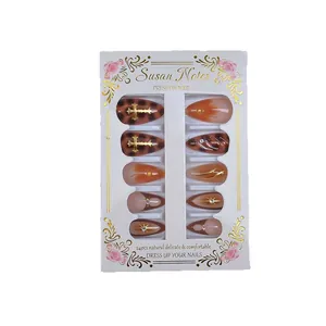 French gradient press-on nails with leopard print and golden 3D cross charms