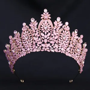 Macro shot of pink marquise crystals and teardrop gemstones on a gold bridal crown