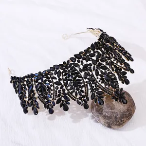 Macro detail of luxury black crystal bridal crown with ornate gold alloy base