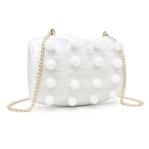 Elegant pearl white marble acrylic evening clutch with gold chain and pearl accents
