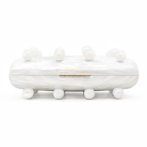 Fashionable acrylic evening clutch bag with marble pattern and large white pearl beads