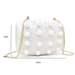 Detailed view of white marble acrylic clutch bag with dimensions 22cm x 13cm x 6cm