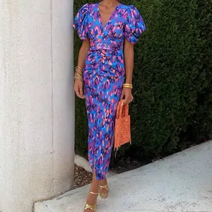 Elegant slim-fit floral dress with blue leopard print and puff sleeves for summer style