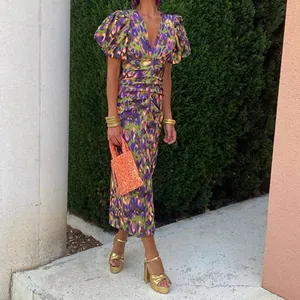 Floral print V-neck maxi dress with puff sleeves and ruched details for spring