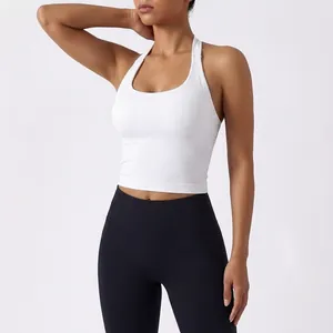 White halter neck sports bra with U-shaped neckline and supportive ribbed fabric