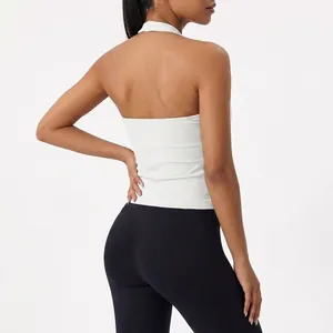 Women's white halter neck sports top and black high waist yoga leggings set