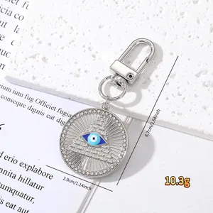 Detail of Hamsa hand keychain with evil eye crystal heart and precise dimension labels