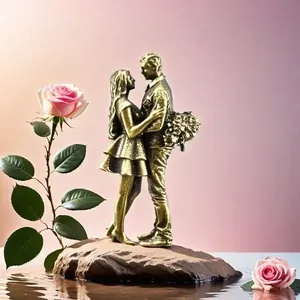 Close-up of brass couple statue with vintage bronze finish on a rock base décor