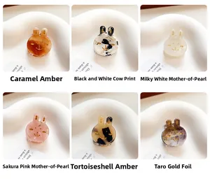 Detail of colorful mini bunny hair clips in acetate finish for elegant hair styling