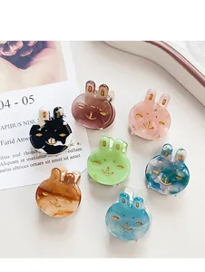 Macro view of 7 colorful rabbit hair clips in acetate finish for girls and women