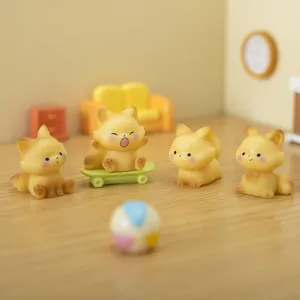 Set of four cute yellow fox figurines in various poses for micro landscape decor