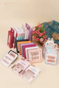 Macro detail of elegant press-on nail packaging styles with various nail art designs
