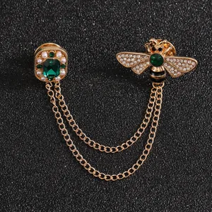 Vintage bee and emerald green gemstone brooch with gold chain tassel accessory