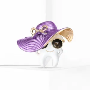 Close-up of a creative cartoon tooth brooch with purple hat and black sunglasses