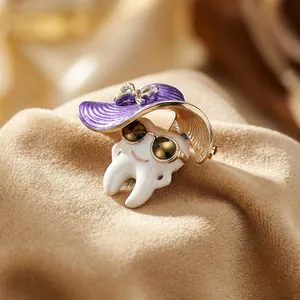 Close-up of creative tooth brooch wearing a purple sun hat with gold bow detailing
