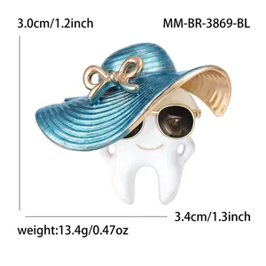 Creative alloy tooth brooch with blue sun hat and gold sunglasses measures 3x3.4cm