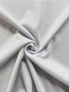 Close-up of white breathable mesh fabric showing premium texture and honeycomb structure