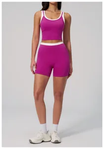 Detail of high-waist ribbed fitness shorts with contrasting white trim in burgundy