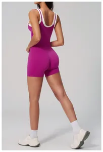 Close-up of seamless purple ribbed yoga set with high-waist shorts and racerback top