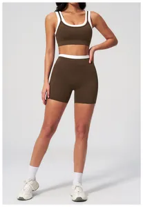 Front view detail of high-waist ribbed yoga set with brown contrast binding trim