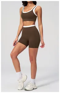 Detail of high-waist yoga shorts and U-neck sports bra with white contrast piping