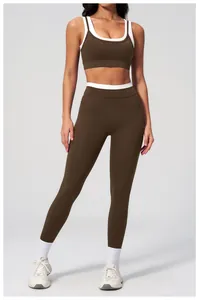 Close-up of olive brown ribbed yoga set with contrast white straps and high waist detail