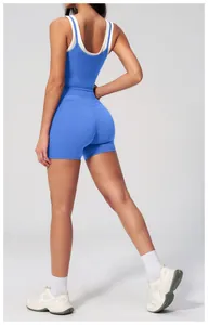 Detail of high-stretch blue athletic romper with layered white ribbed tank top