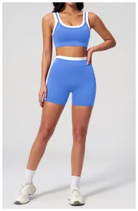 Detail of high-stretch klein blue ribbed yoga set with white trim and wide waistband