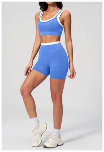 Detail showing high-waisted yoga shorts with white trim and ribbed elastic fabric