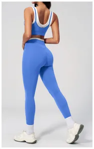 Detail view of the seamless high-waist yoga set with contrast white waistband and straps