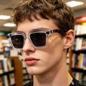 Detail of vintage square sunglasses with clear frame and tortoiseshell patterned temples