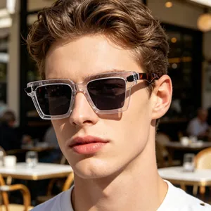 Detail view of retro square sunglasses with transparent frame and tortoiseshell temples