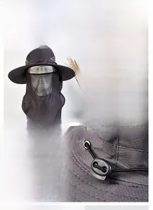 Detail of adjustable drawstring buckle and 12cm wide brim on dark grey sun hat