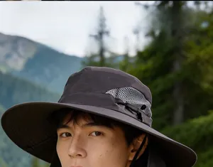 Close-up of dark grey sun hat with breathable mesh fabric and adjustable side cord