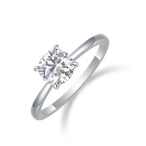 Elegant 925 sterling silver four-prong moissanite engagement ring on white background